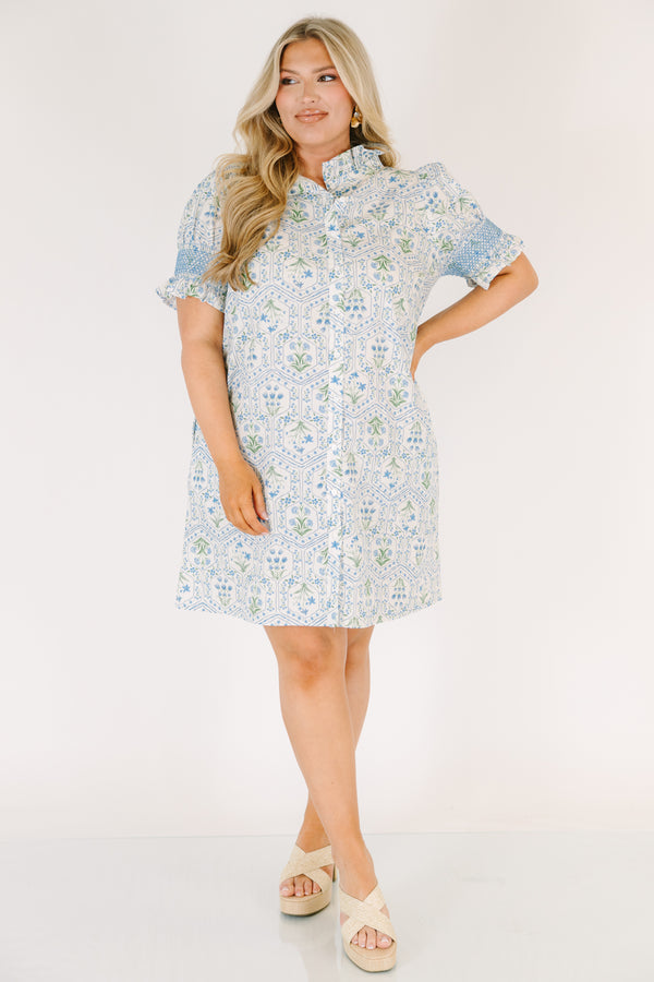 Chic Soul plus size clothing, blue knee length dress with bubble sleeves that have blue stitching details on the ends of sleeves and a floral block pattern throughout 