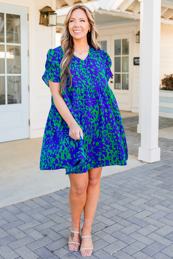 Chic Soul plus size clothing, short sleeve green flowy dress with royal blue spotted pattern and v-neckline with puffed sleeves