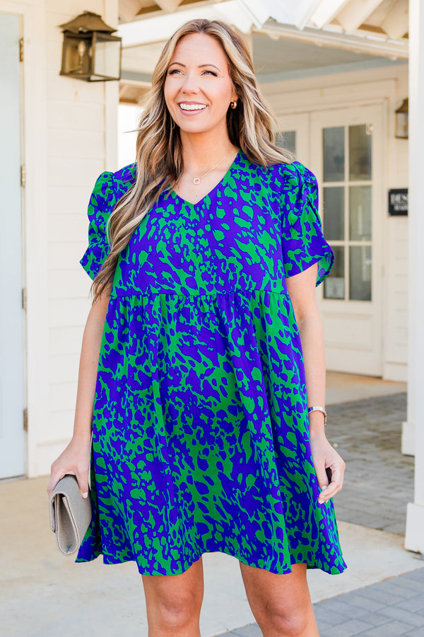 Chic Soul plus size clothing, short sleeve green flowy dress with royal blue spotted pattern and v-neckline with puffed sleeves