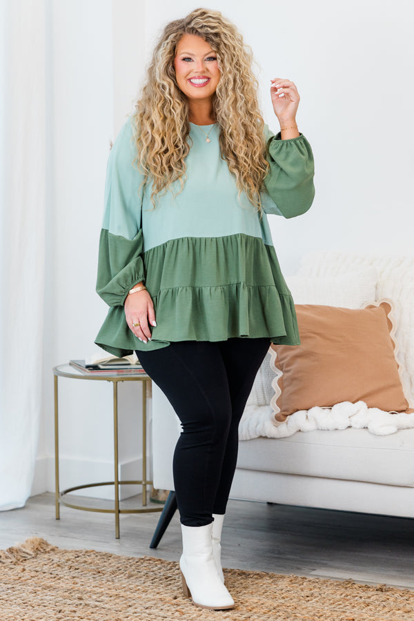 Plus Size colorblock sage green long sleeve top with a tiered babydoll hem and round neckline.