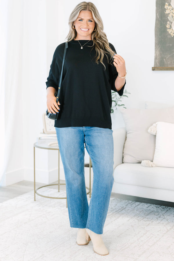 Plus size black short sleeve sweater with a flowy fit and ribbed hem