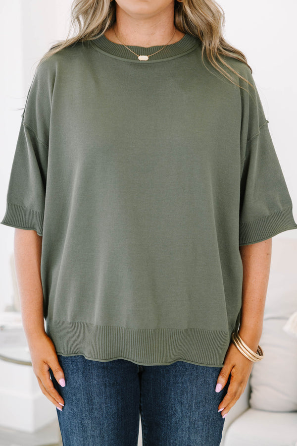 Plus size olive green short sleeve sweater with a relaxed fit and ribbed crew neckline.