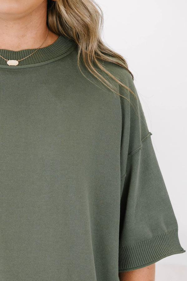 Plus size olive green short sleeve sweater with a relaxed fit and ribbed crew neckline.
