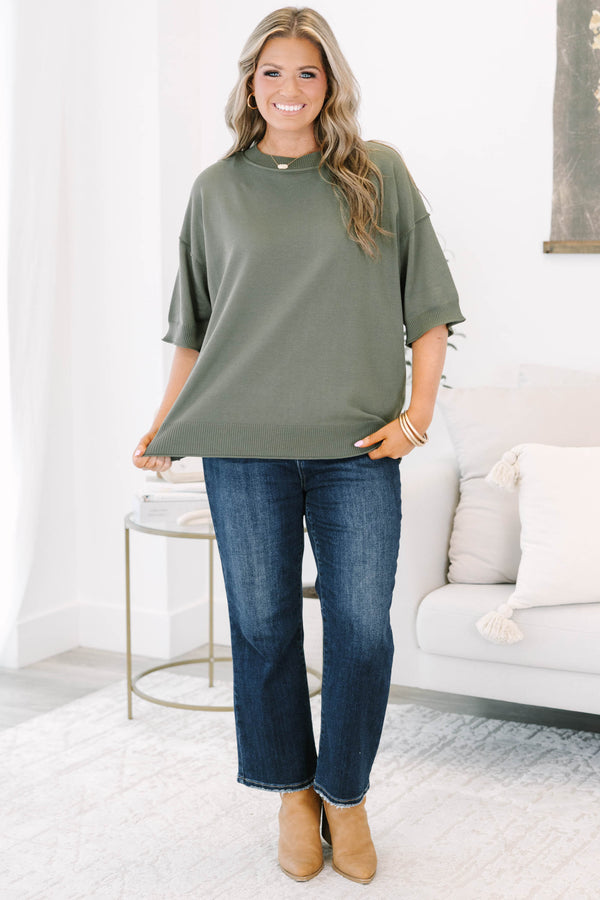 Plus size olive green short sleeve sweater with a relaxed fit and ribbed crew neckline.