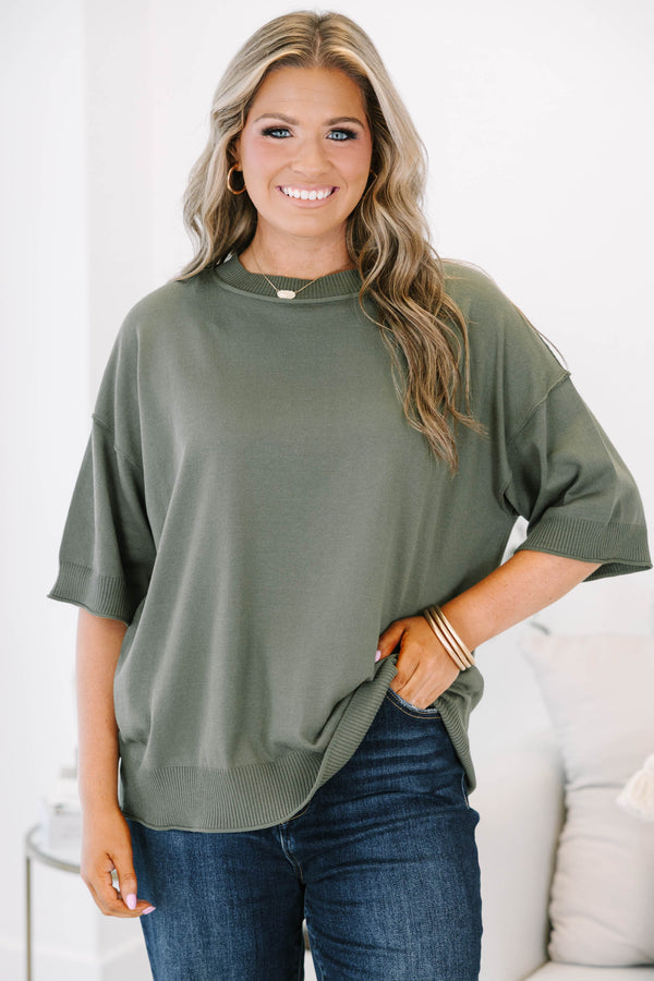 Plus size olive green short sleeve sweater with a relaxed fit and ribbed crew neckline.