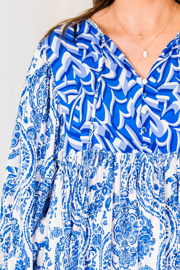 Chic Soul plus size clothing, royal blue mini dress with three quarter length sleeves with tiered pattern detail abstract and paisley print with v cutout on neckline with tie detail