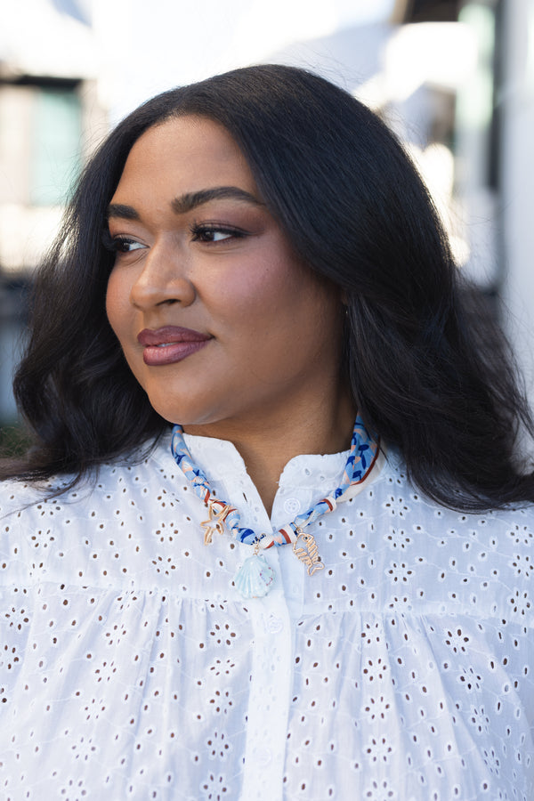 Chic Soul plus size clothing, blue scarf necklace with three charms of a shell starfish and fish attached to the scarf 