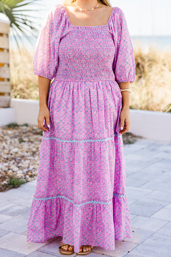 Plus Size pink ditsy floral maxi dress with a smocked bodice, puff sleeves, and tiered ric rac skirt.