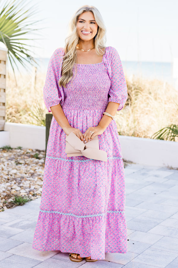 Plus Size pink ditsy floral maxi dress with a smocked bodice, puff sleeves, and tiered ric rac skirt.