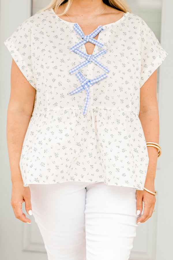 Chic Soul plus size clothing, white short sleeve top with blue small floral pint with blue gingham ties down the center