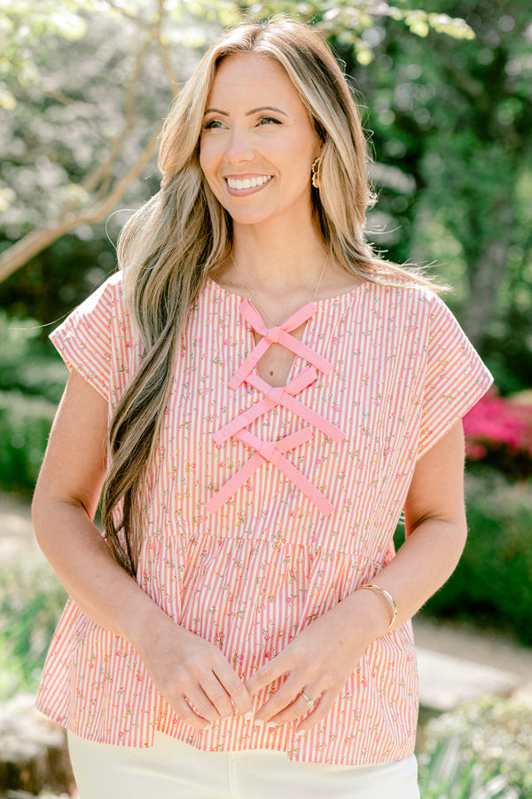 Chic Soul plus size clothing, pink stripe short sleeve top with ruffle along the bottom with bow tie detail along the front