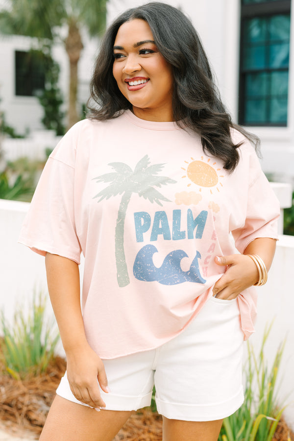 Plus Size blush pink vintage wash tee with a palm tree graphic and white denim shorts.