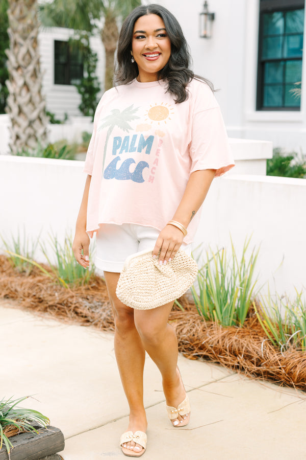 Plus Size blush pink vintage wash tee with a palm tree graphic and white denim shorts.