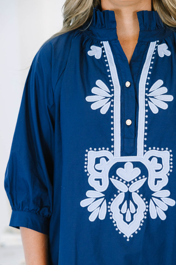 Plus Size blue shift dress with white embroidery, ruffled collar, and three-quarter puff sleeves.