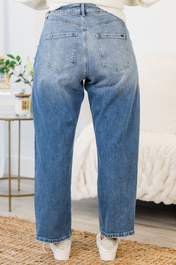 Chic Soul plus size clothing, mid-waisted medium wash denim mom jeans with white flower decals scattered along the front of the jeans