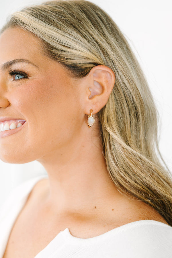 Plus Size gold drop earrings with a smooth, oval white stone inlay.