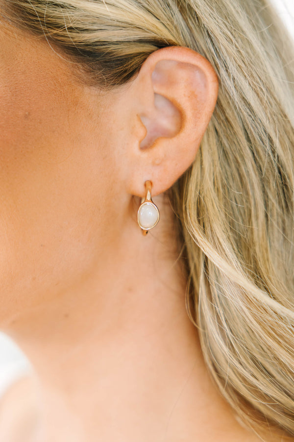 Plus Size gold drop earrings with a smooth, oval white stone inlay.