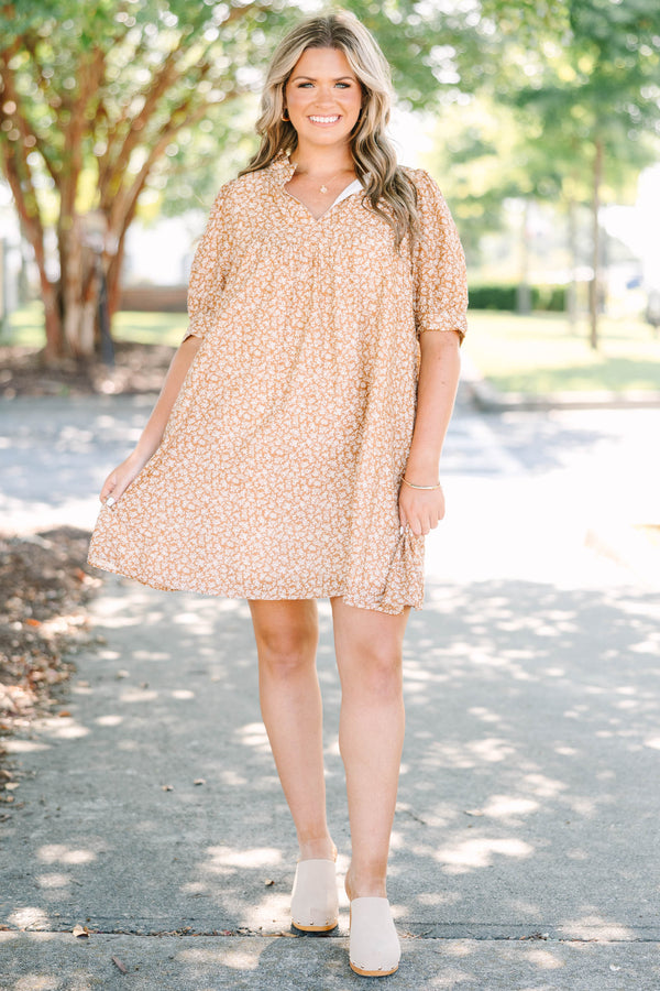 Plus Size brown floral mini dress with a V-neckline, short puff sleeves, and a relaxed babydoll fit.