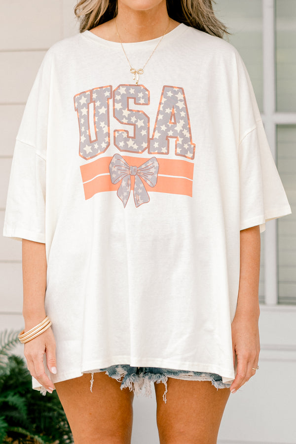 Plus Size ivory oversized boyfriend tee with a USA and bow graphic in a patriotic star pattern.