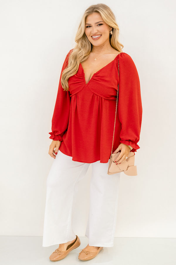 Plus Size red v-neck top with elastic balloon sleeves and a smocked back in a textured fabric.