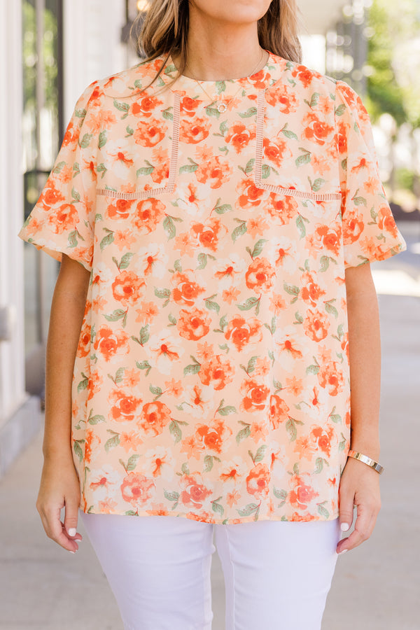 Chic Soul plus size clothing, orange short sleeve flowy top with orange floral print with stitch design along chest