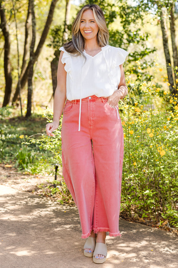 Chic Soul plus size clothing, high-waisted peach blossom pink cropped wide-leg jeans with fraying along the hemline 