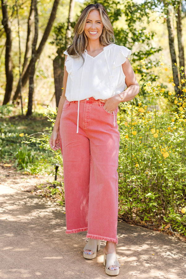 Chic Soul plus size clothing, high-waisted peach blossom pink cropped wide-leg jeans with fraying along the hemline 