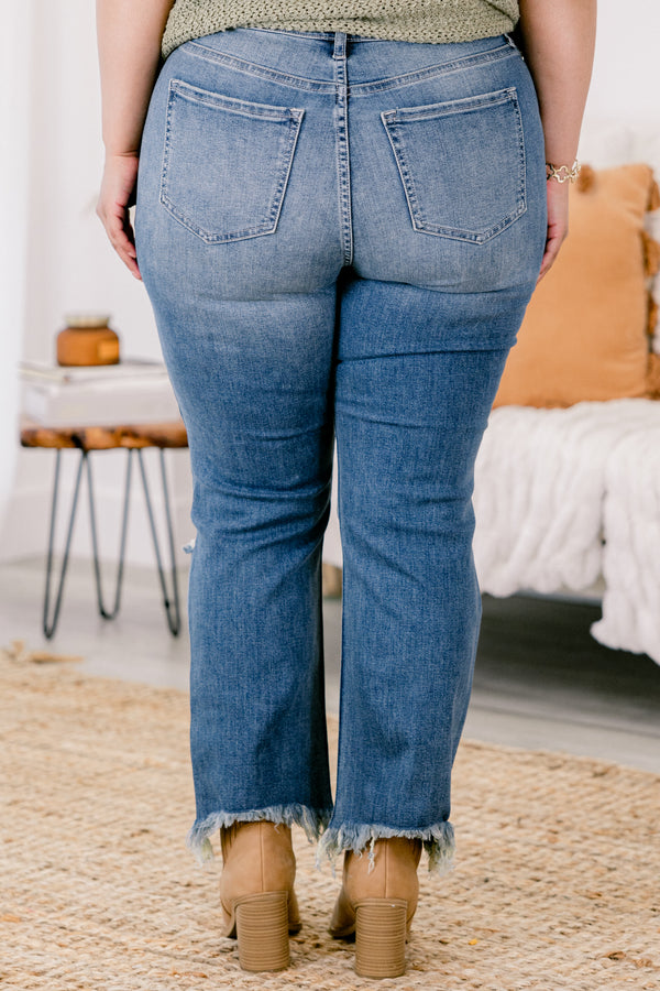 Chic Soul plus size clothing, medium wash distressed denim jeans with rips at the knees and fringe hem