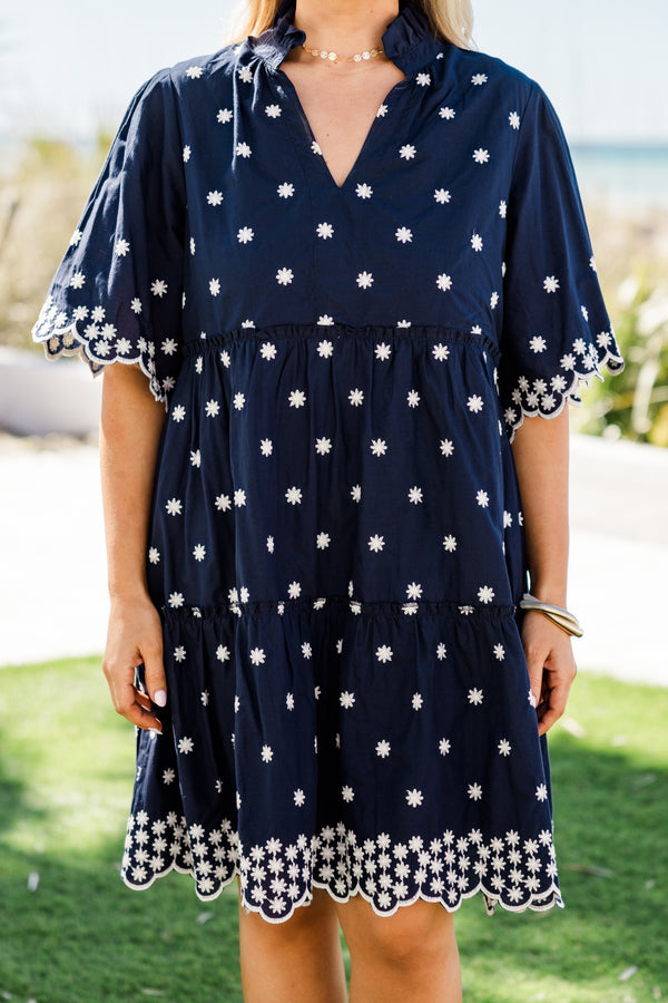 Chic Soul plus size clothing, short-sleeve navy blue ruffled baby doll dress with a split-v-neckline and white embroidered floral detailing along the dress with a scalloped embroidered hem