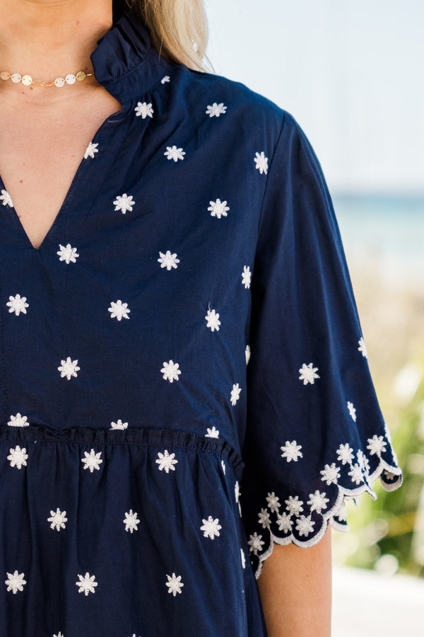 Chic Soul plus size clothing, short-sleeve navy blue ruffled baby doll dress with a split-v-neckline and white embroidered floral detailing along the dress with a scalloped embroidered hem