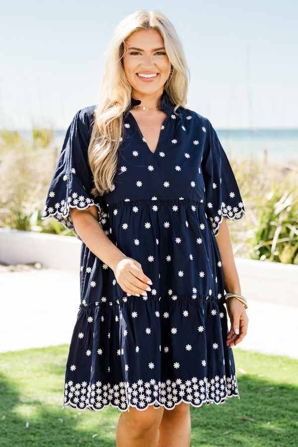 Chic Soul plus size clothing, short-sleeve navy blue ruffled baby doll dress with a split-v-neckline and white embroidered floral detailing along the dress with a scalloped embroidered hem