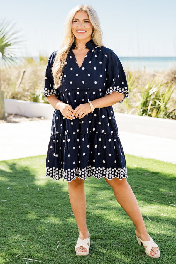 Chic Soul plus size clothing, short-sleeve navy blue ruffled baby doll dress with a split-v-neckline and white embroidered floral detailing along the dress with a scalloped embroidered hem