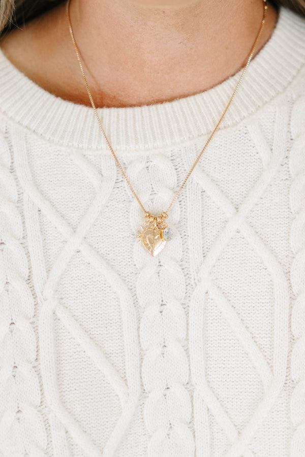 Plus Size gold chain necklace with a heart-shaped pendant and small clear stone charm.
