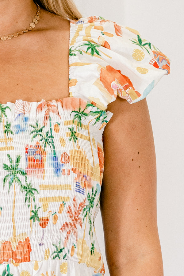 Chic Soul plus size clothing, white tiered ruffle jumpsuit with smocked top and ruffle strap sleeves with orange tropical print