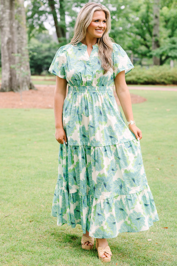 Chic Soul plus size clothing, short-sleeve green maxi dress with a smocked waistline and a watercolor floral print with a tiered skirt and a v-neckline