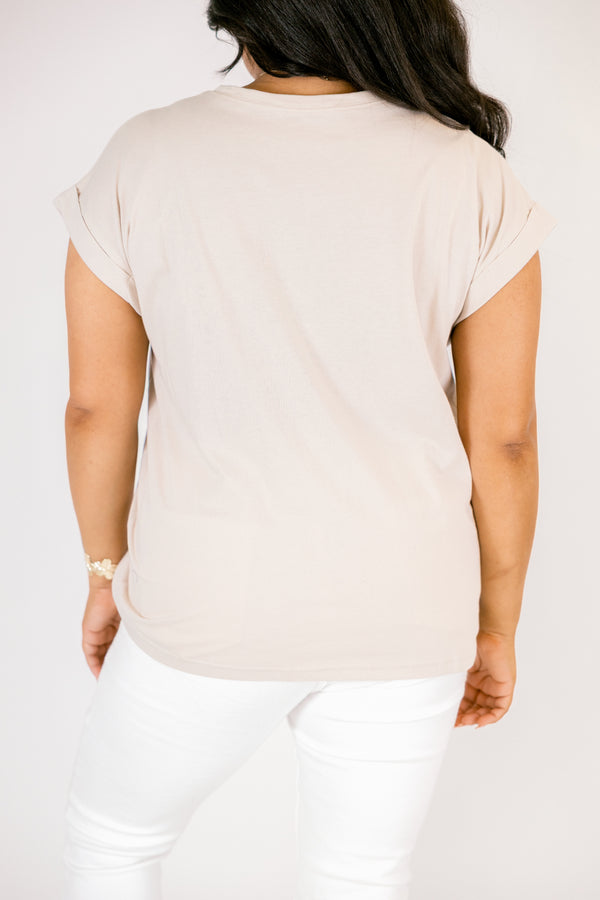 Plus Size sand beige 100% cotton crew neck tee with cuffed short sleeves and white pants.