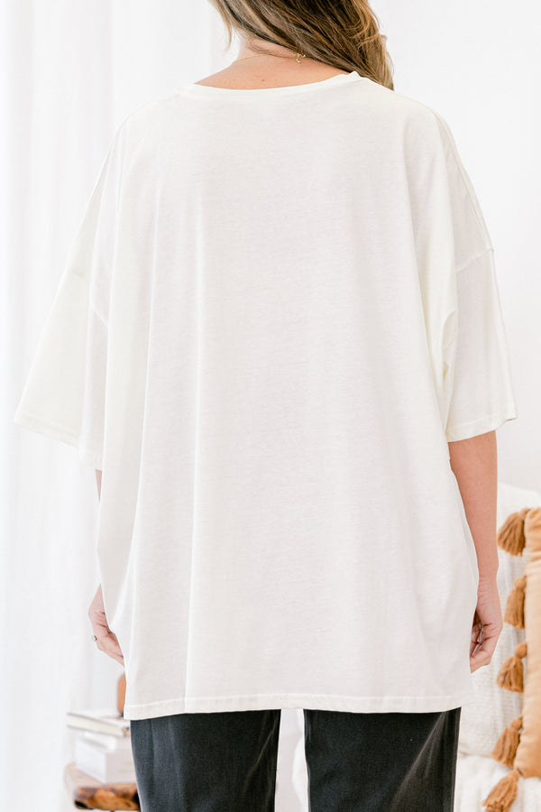 Chic Soul plus size clothing, Ivory short sleeve graphic tee with a jack-O-lantern on the center of the shirt that is filled with various patterns 