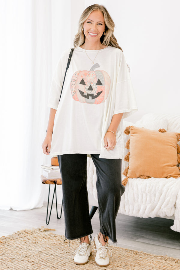 Chic Soul plus size clothing, Ivory short sleeve graphic tee with a jack-O-lantern on the center of the shirt that is filled with various patterns 