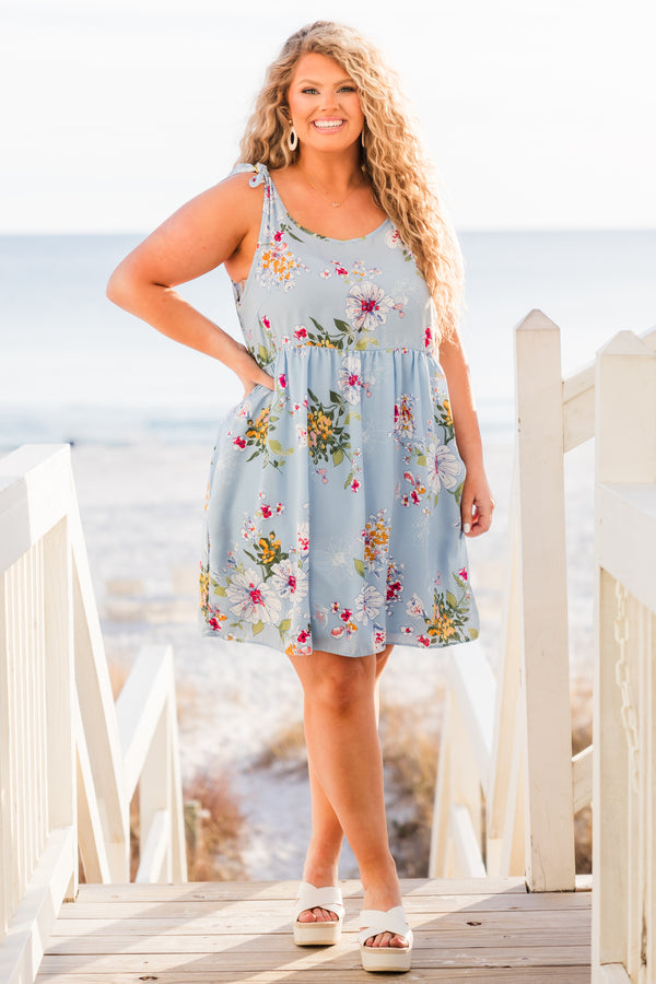 Chic Soul plus size clothing, blue sleeveless mini dress with floral design with tie straps and round neckline with pockets