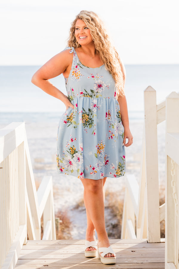 Chic Soul plus size clothing, blue sleeveless mini dress with floral design with tie straps and round neckline with pockets