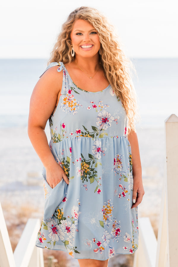 Chic Soul plus size clothing, blue sleeveless mini dress with floral design with tie straps and round neckline with pockets
