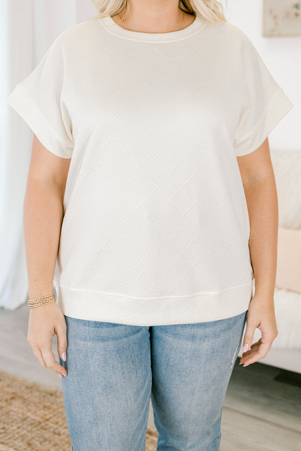 Chic Soul plus size clothing,  short-sleeve ivory top with a textured geometric pattern with subtle raised lines in a diagonal grid design and a high-scoop-neckline
