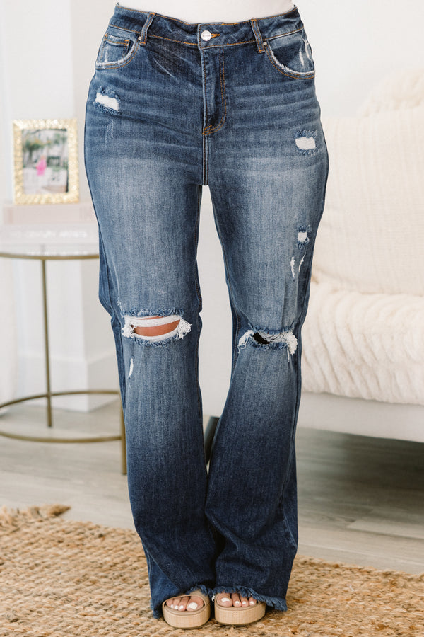Chic Soul plus size clothing, dark wash distressed jeans with a loose fit and holes in the knees 