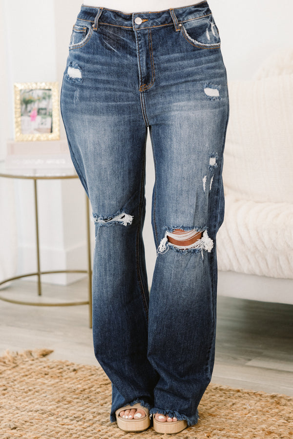 Chic Soul plus size clothing, dark wash distressed jeans with a loose fit and holes in the knees 