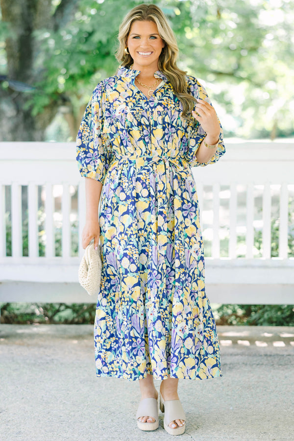 Plus Size navy floral midi dress with puff sleeves, a tiered skirt, and a matching waist tie.