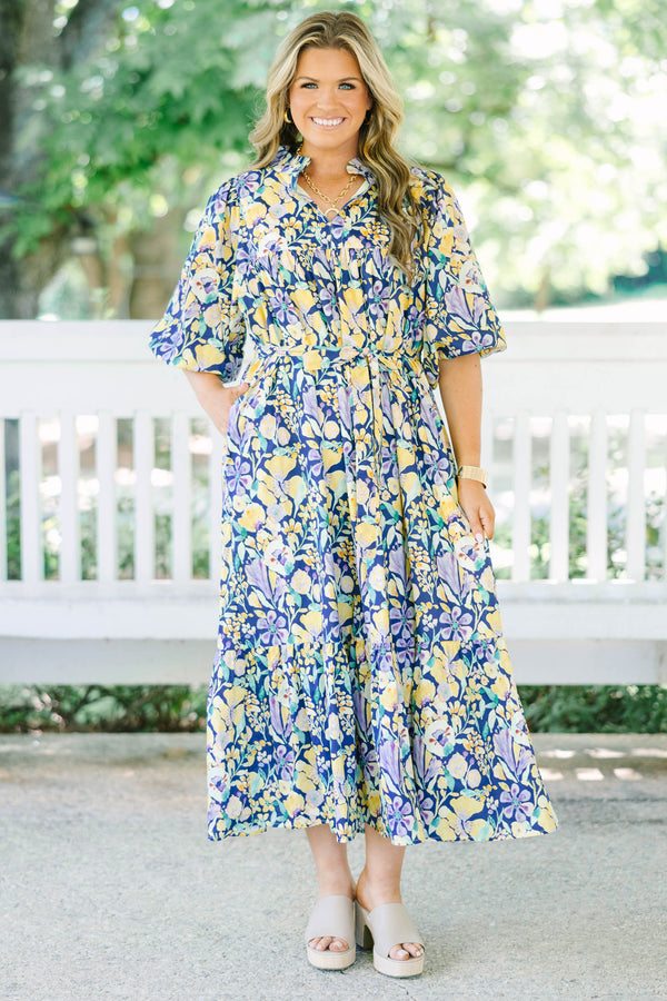 Plus Size navy floral midi dress with puff sleeves, a tiered skirt, and a matching waist tie.