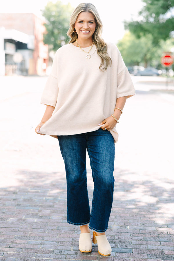 Plus Size taupe short sleeve sweater with a crew neckline and relaxed fit in a soft knit fabric.
