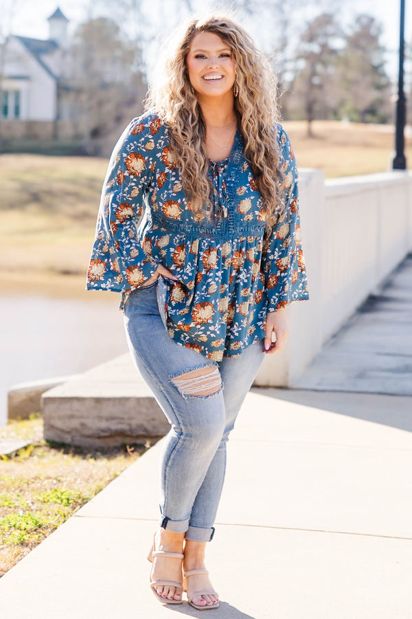 Chic Soul plus size clothing, blue flare sleeve long sleeve top with orange/ivory floral design with tie detail on neckline and lace along waist and collar