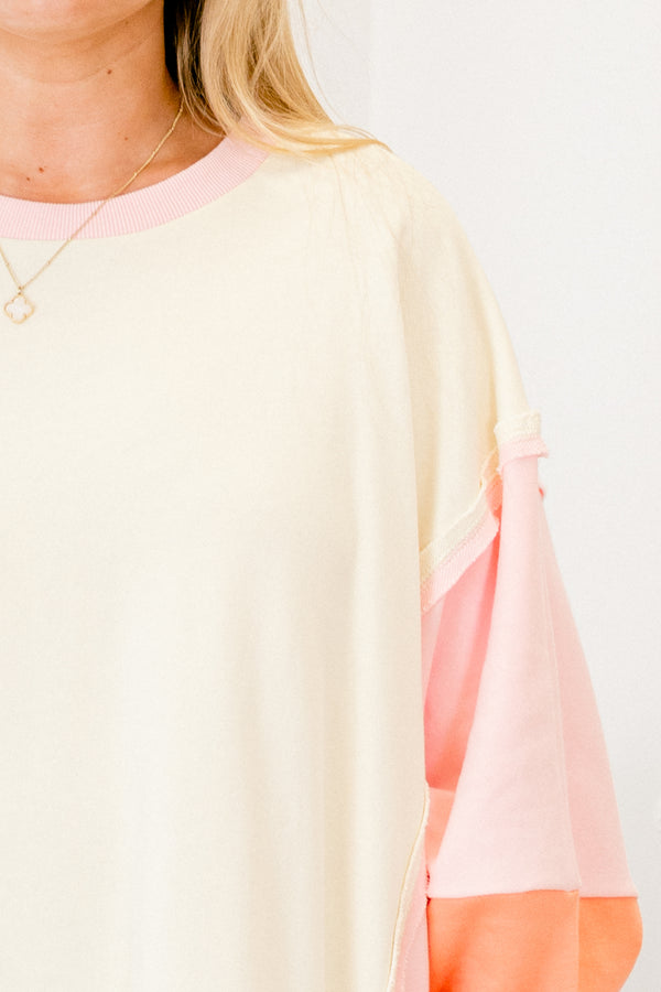 Chic Soul plus size clothing, salmon colored pullover with color block details on the sleeves and at the end of the shirt 