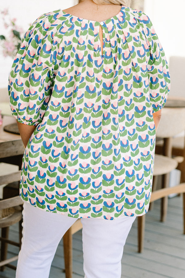 Chic Soul plus size clothing, green short sleeve top with pink/blue/green tulip design with round neckline with puff cuffed sleeves